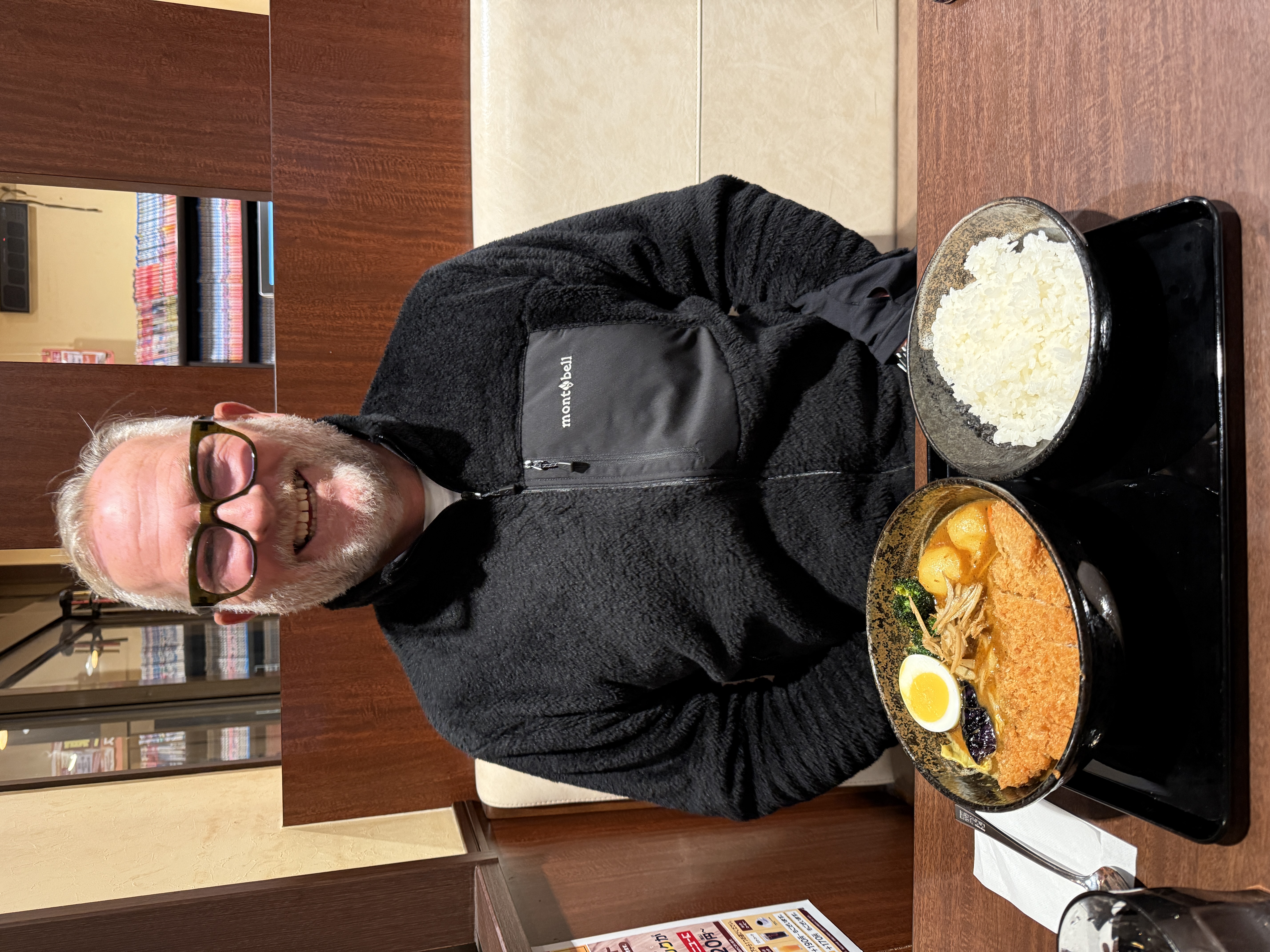 Pete smiling over a meal in Japan